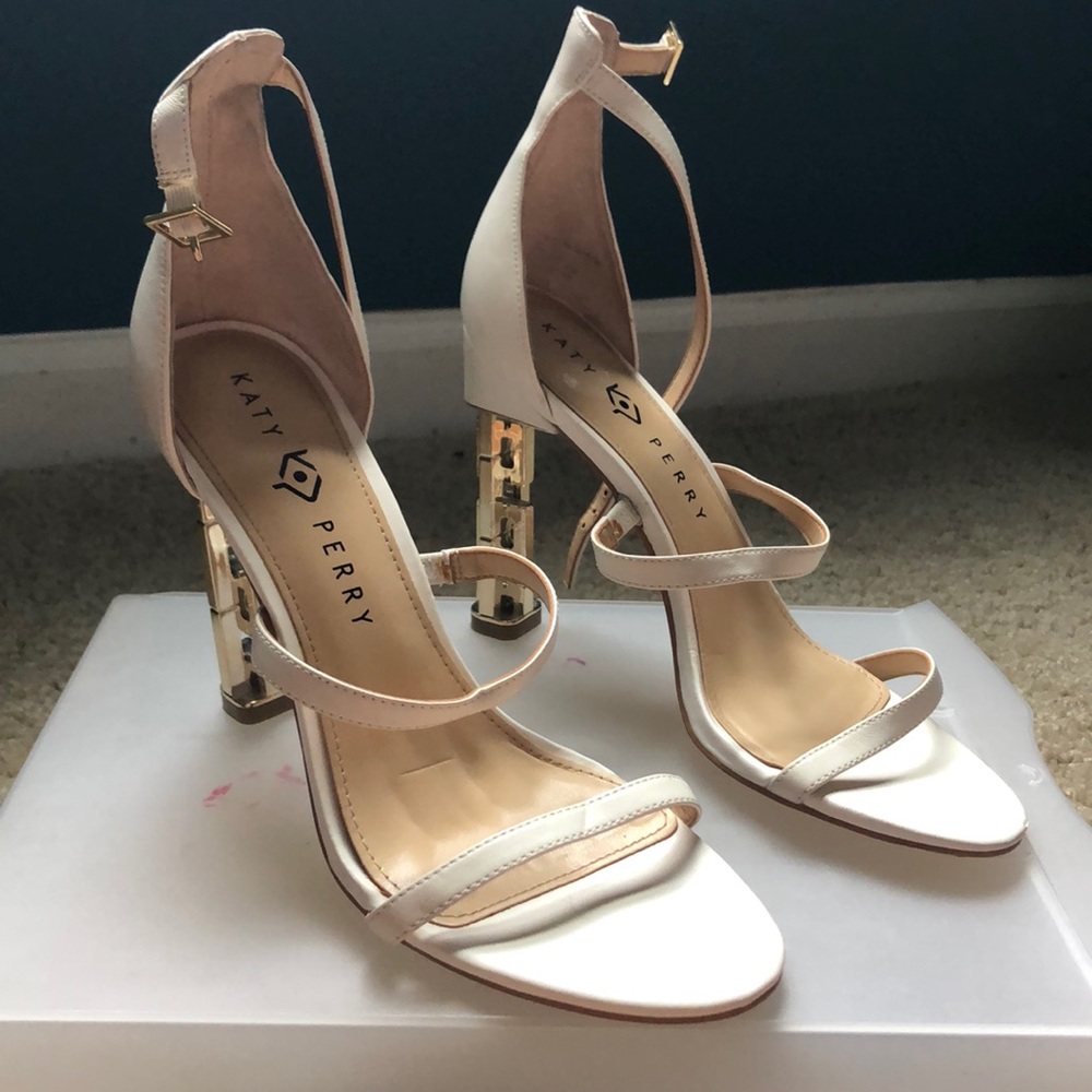 White heel with gold chain back.